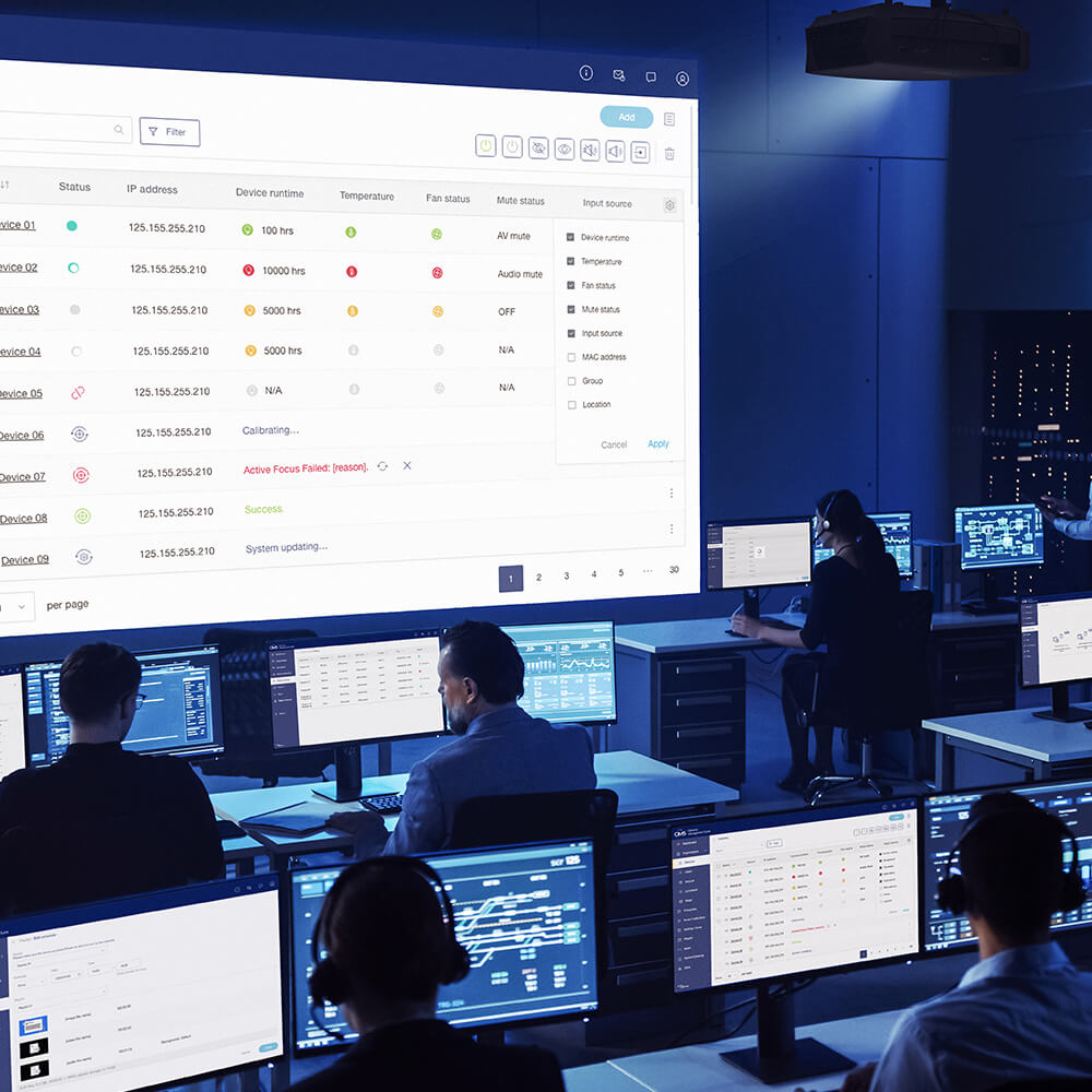 Mission-critical control room with multiple monitor displays and real-time data management systems. Advanced command center technology featuring large-scale video walls, operator workstations, and integrated monitoring solutions for security operations, network management, and industrial control applications.